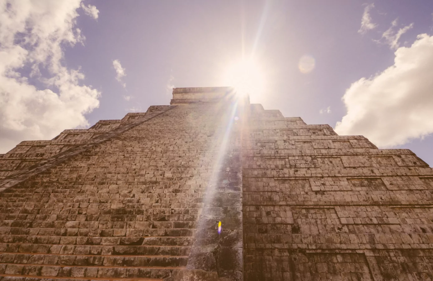 Sunlight over a Mayan pyramid symbolizing harmony with natural cycles